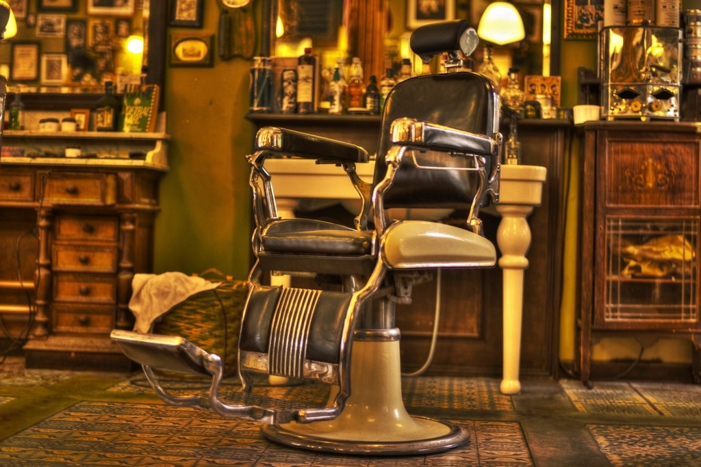 Classic barber chair in a warmly lit shop